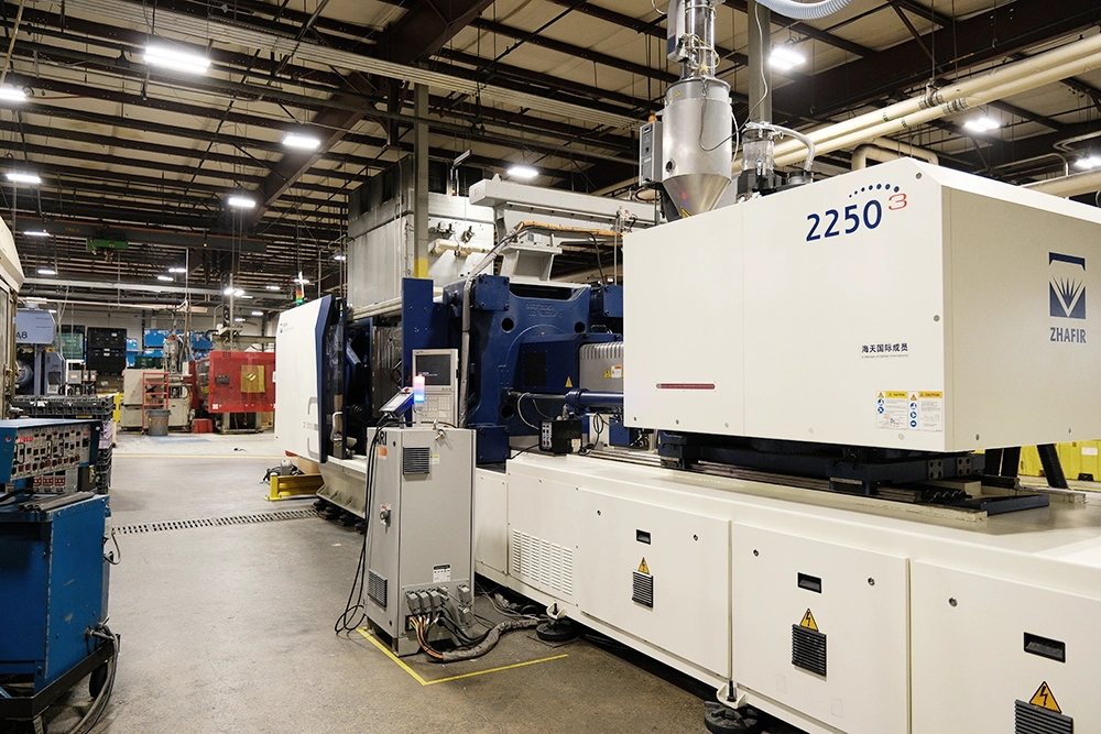 Zhafir injection molding machine on a production floor